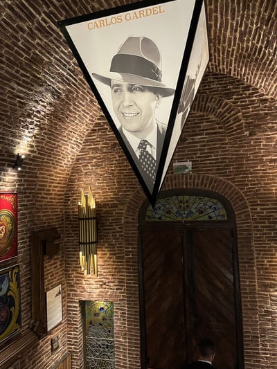A vaulted brick wine cellar lined with bottles, Argentina.