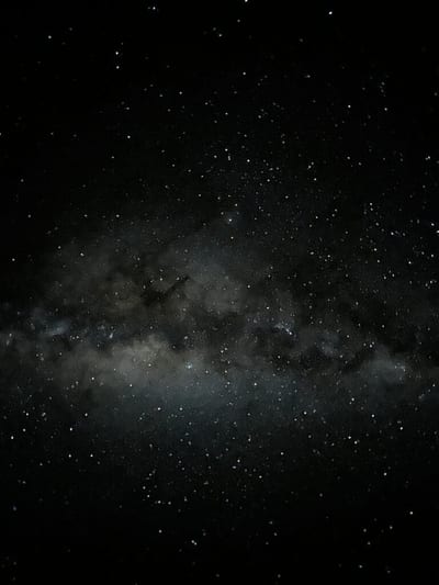 The luminous band of the Milky Way galaxy stretching across a star-filled night sky over the Atacama Desert, Chile.