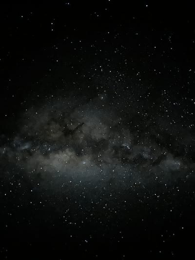 The Milky Way arcing across a dark star-filled night sky over the Atacama Desert, Chile