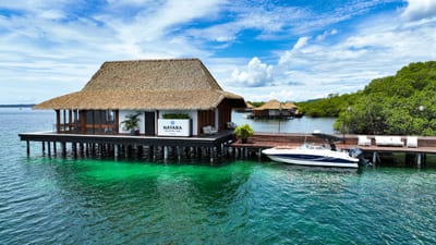 An overwater bungalow on the turquoise Caribbean Sea, Bocas del Toro, Panama.