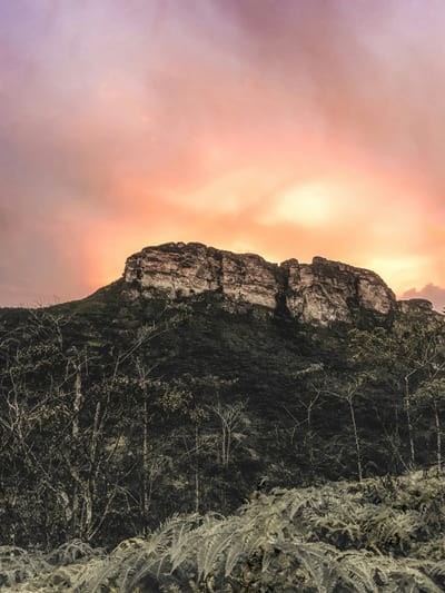 The flat-topped Morro do Pai Inácio mesa rising above the Chapada Diamantina highlands at sunset, Bahia, Brazil.
