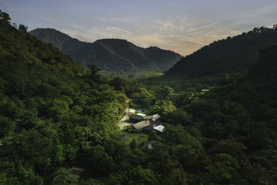 Aerial view at dusk of El Silencio Lodge & Spa set in a private cloud forest reserve valley in Bajos del Toro, Costa Rica