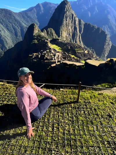 Explore the Americas co-founder Kathleen on the agricultural terraces above the Machu Picchu citadel, Peru