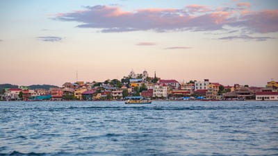 The island town of Flores on Lake Peten Itza at dusk, Peten, Guatemala