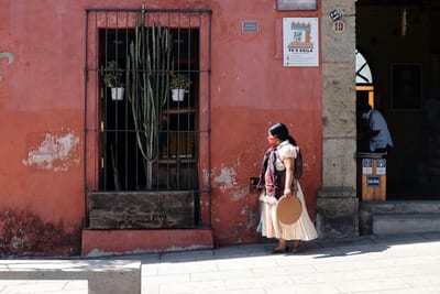 A colorful Oaxaca street strung with papel picado banners, Mexico.