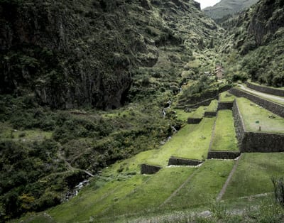 Ancient Inca agricultural terraces carved into the mountainside at Pisac in the Sacred Valley, Peru.