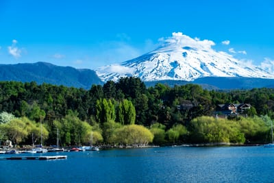 Small boats rest on a lake at Pucon in Chile's Lake District.