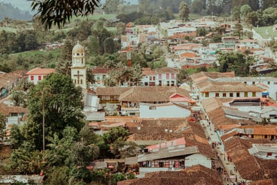 A colorful coffee-region town set in green hills, Colombia.