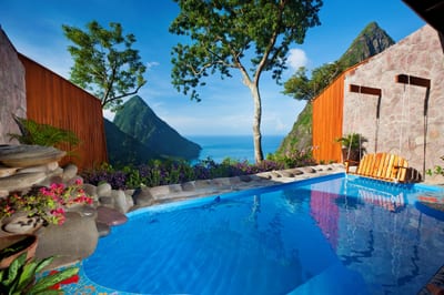 A plunge pool opens to a sweeping Piton view, St. Lucia.