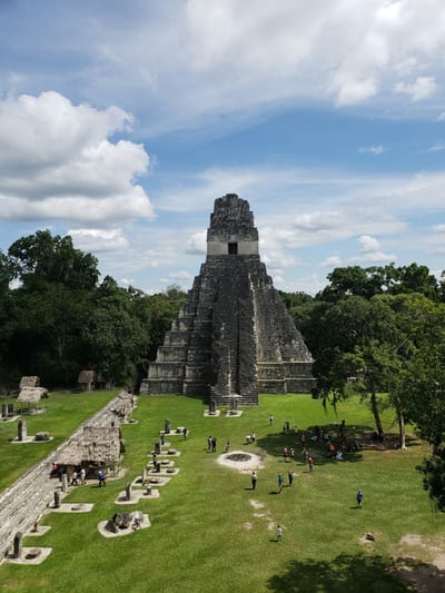 The twin temples of Tikal's Grand Plaza stand in the Petén jungle, Guatemala.