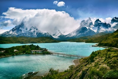 The snow-capped Torres del Paine massif rises above a glacial lake, Chilean Patagonia.