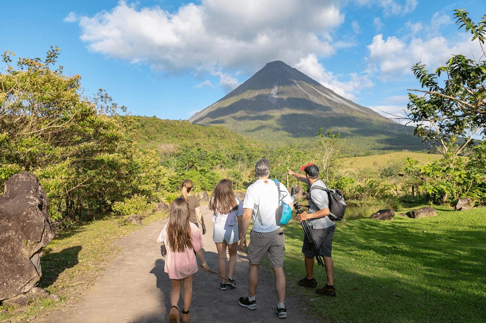 Family with a tour guide exploring the area near Arenal Volcano in Costa Rica, enjoying a guided nature experience.